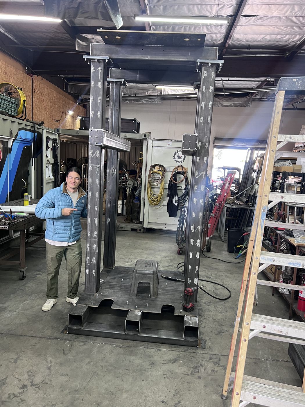 Me and the raw frame at the welder's shop